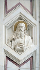 Fototapeta na wymiar Apostle, relief on the facade of Basilica of Santa Croce (Basilica of the Holy Cross) - famous Franciscan church in Florence, Italy