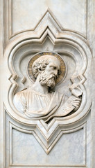 Saint, relief on the facade of Basilica of Santa Croce (Basilica of the Holy Cross) - famous Franciscan church in Florence, Italy