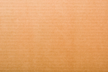 Fototapeta na wymiar Texture or background of corrugated cardboard. Light brown backdrop.
