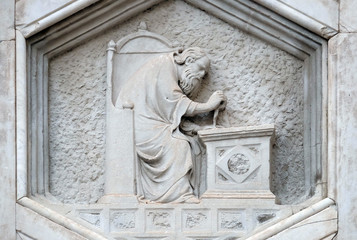 Fototapeta na wymiar Allegory of architecture from the workshop of Pisano, Relief on Giotto Campanile of Cattedrale di Santa Maria del Fiore (Cathedral of Saint Mary of the Flower), Florence, Italy