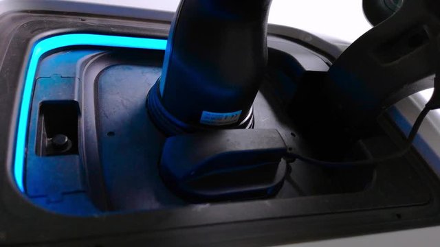 charging electric car with a Type 2 charger, blue light is blinking