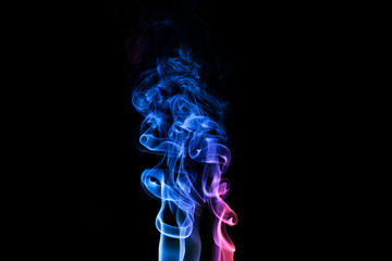 Abstract backgrounds and wallpapers. Colorful smoke on black background..