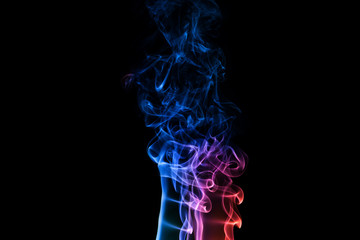 Abstract backgrounds and wallpapers. Colorful smoke on black background..