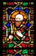 Fototapeta na wymiar Catholic Saint, stained glass window in the Basilica di Santa Croce (Basilica of the Holy Cross) - famous Franciscan church in Florence, Italy
