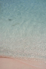Fototapeta na wymiar Clear sea water ripple background. Elafonisi beach, Crete Island landmark.