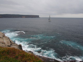 rocky shore and yacht