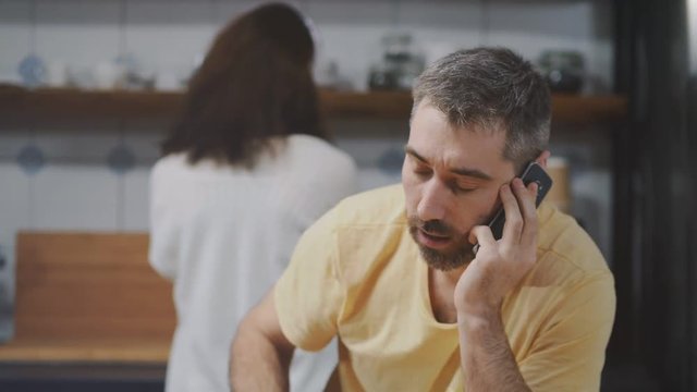 Portrait of smiling man talking on mobile phone