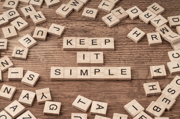 Keep it simple written with wooden letters