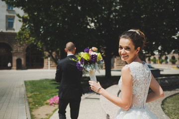 Bride and groom walking in the city