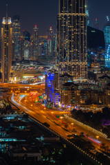 Obraz na płótnie Canvas Colourful night time view of downtown Dubai
