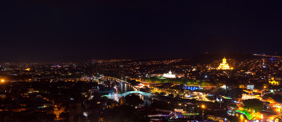 Fototapeta na wymiar Amazing night panoramic cityscape of Georgian Capital old town, Tbilisi.