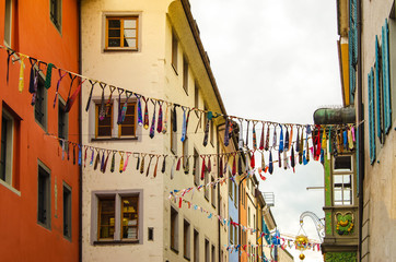 Fototapeta na wymiar street decorated with garlands of men's ties for the holiday