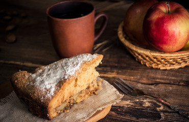 Rural still life with apple pie, coffee and apples on wooden background