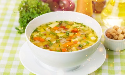 Chicken vegetable soup on desk