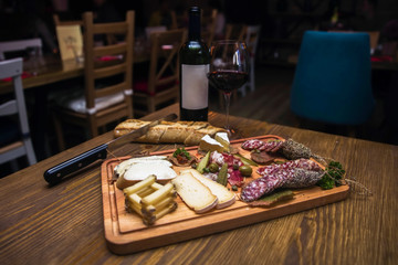 Cheese, sausages and red wine as an appetizer