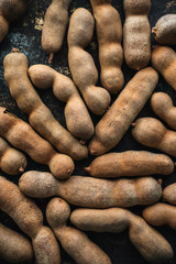 Fresh ripe tamarind on rustic background