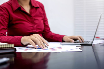 Business women working with financial reports at office.