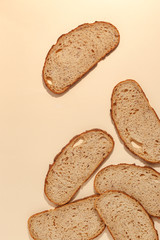 sliced of rye bread, isolated on a brown background