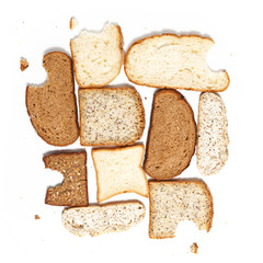 Set of several slices of different bread on a white background.