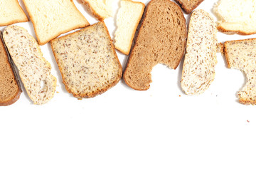 Set of several slices of different bread on a white background.