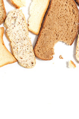 Set of several slices of different bread on a white background.