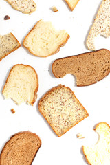 Set of several slices of different bread on a white background.