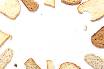 Set of several slices of different bread on a white background.