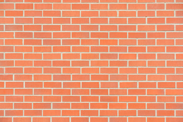 New red brick wall texture background with grey grout filling