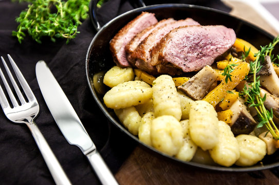 Roasted duck with pear,marinated in red wine with gnocchi and Oysters