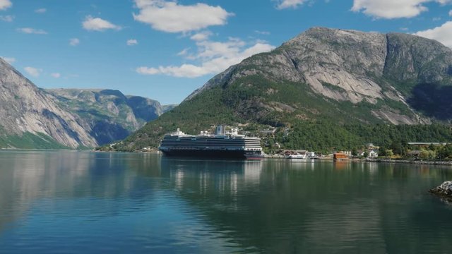 Drive along the picturesque coast of the fjord, where the ocean liner is moored