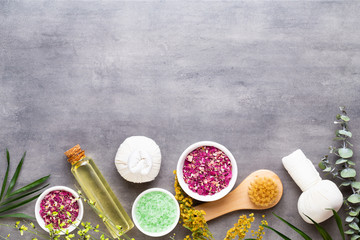 Spa treatment concept, flat lay composition with natural cosmetic products and massage brush, view from above, blank space for a text.