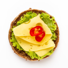Sandwich with lettuce, cheese on white background.