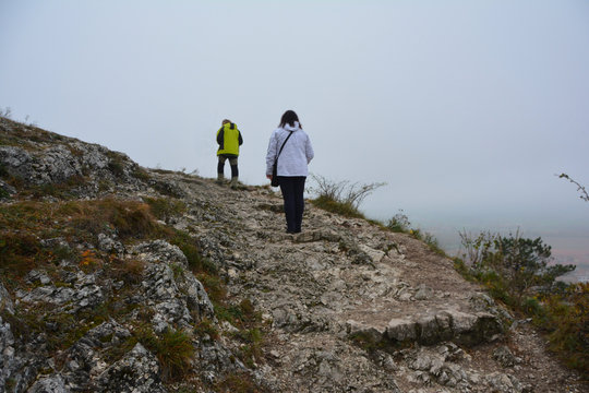 The People Going Uphill In Autumn Day