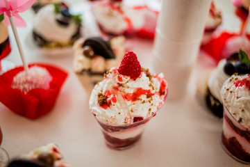 The luscious cupcakes are laid out on the trays