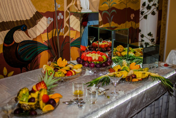 Candy bar. .Delicious fruits on saucers
