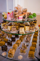 Candy bar. .Delicious cakes on saucers