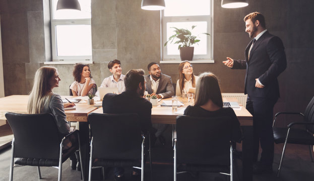 Business managers discussing project plans in office