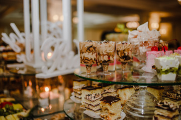 Exquisite  cupcakes are laid out on the trays