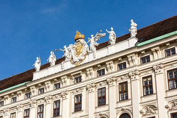 Obraz premium Austria, Vienna, Hofburg Palace, Beautiful facade of famous Redoutensaaltrakt at Josefsplatz in the city center of the capital with blue sky in the background - concept Habsburg architecture history