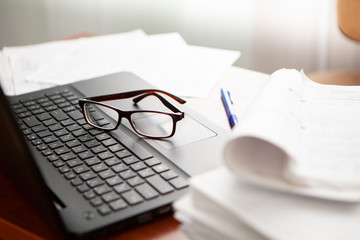 office desk a stack of computer paper reports work forms