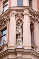 Statue on facade of the old city building in Zagreb, Croatia 