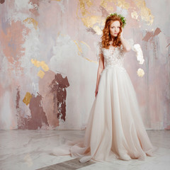 Elegant red-haired girl bride. Young beautiful woman in wedding dress