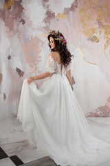 Elegant brunette girl bride. Young beautiful woman in wedding dress