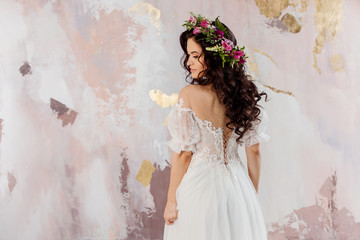 Elegant brunette girl bride. Young beautiful woman in wedding dress