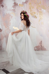 Elegant brunette girl bride. Young beautiful woman in wedding dress