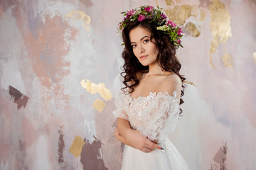 Elegant brunette girl bride. Young beautiful woman in wedding dress