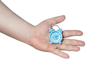 men's hand holding small blue alarm clock on white background.