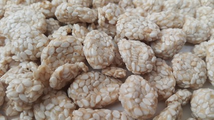 Closeup view of home made Asian sweet feed rewri or rewdi