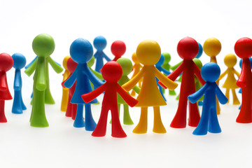 Colorful painted group of people figures on white background