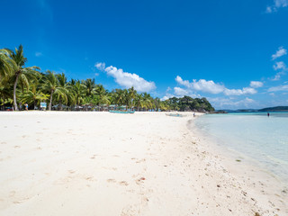View of tropical beach on the island Malcapuya. Beautiful tropical island with sand beach, palm trees. Travel tropical concept. Palawan, Philippines. October, 2018